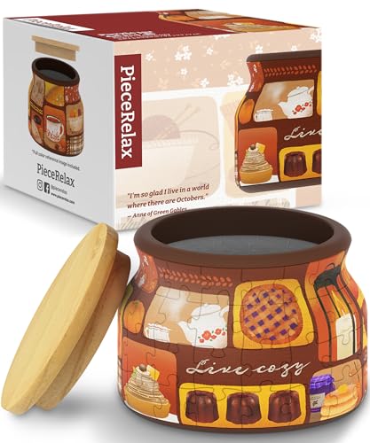 Live Cozy jigsaw puzzle from Pintoo Corporation, featuring a colorful design of various cozy kitchen items in a jar shape. The image showcases the puzzle pieces and the charming packaging with a lid, perfect for puzzle enthusiasts and gift-giving.