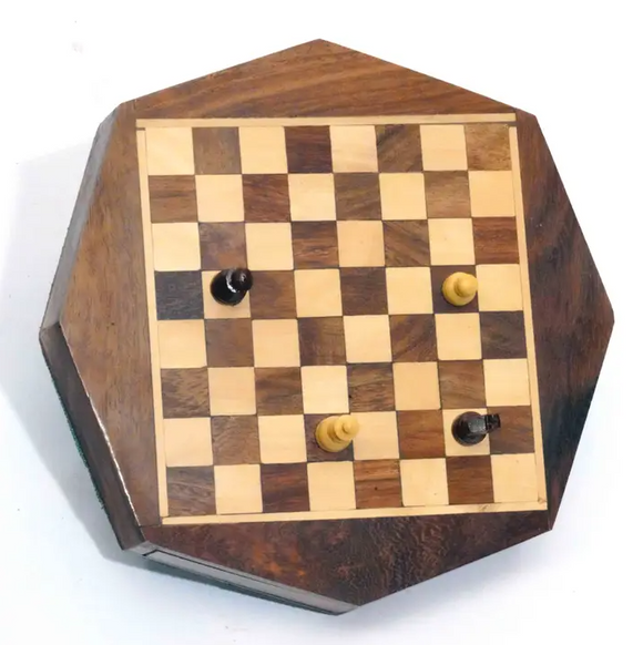 A beautiful 6-inch octagon wooden chess board with a checkered pattern in light and dark wood, featuring four chess pieces placed on the board. The classic design showcases the craftsmanship of R. Expo, making it a perfect addition to any game collection.