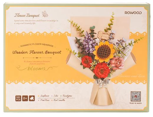 A beautifully designed DIY kit showcasing a Wooden Flower Bouquet. The kit includes various wooden flower pieces featuring sunflowers, roses, and other lush greenery, all ready to assemble. The packaging highlights romantic flower meanings, making it a perfect gift for loved ones. Suitable for ages 8 and up, this creative project encourages craftsmanship and adds a touch of nature to any decor.