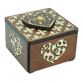 The Heart Box by Jean Claude is a beautifully crafted mechanical puzzle made of wood. It features intricate heart designs and ornate details, with a unique opening mechanism that challenges the mind. The box showcases a combination of elegant craftsmanship and playful ingenuity, making it a perfect gift or decorative item.