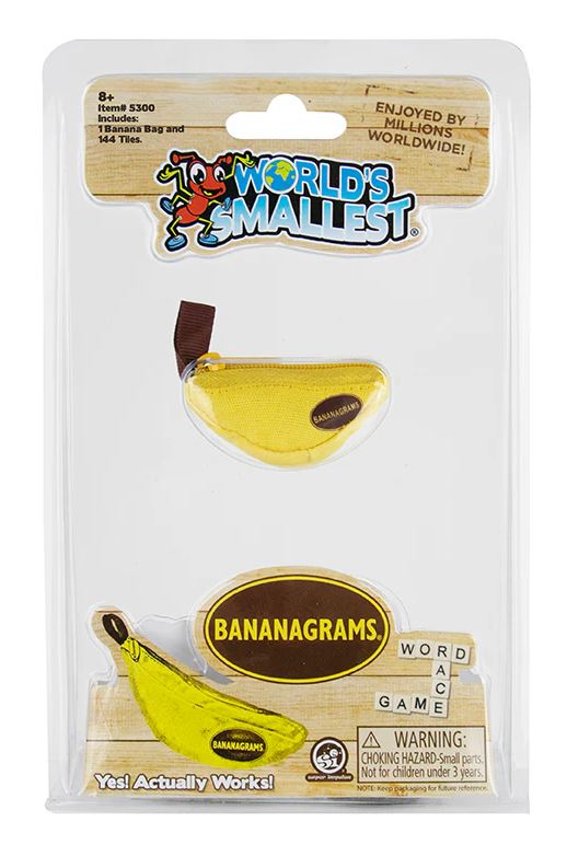 The World's Smallest Bananagrams game features a miniature yellow banana-shaped bag containing 144 tiles, designed for word play. The packaging is bright and playful, showcasing the game, suitable for ages 8 and up, with a warning about small parts.