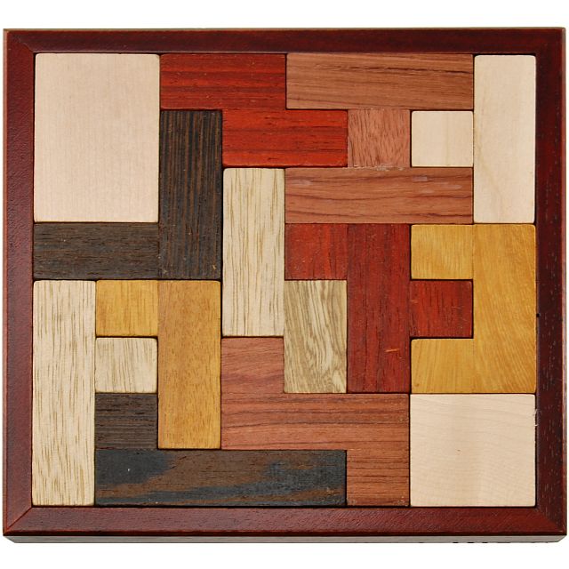 Lila Holz Micro by Jean Claude is a handcrafted mechanical puzzle featuring a variety of wooden pieces in different shapes and colors. The puzzle is arranged in a wooden frame, showcasing an intricate design that encourages critical thinking and problem-solving skills. Ideal for both adults and children, this puzzle promotes cognitive development while providing hours of entertainment.