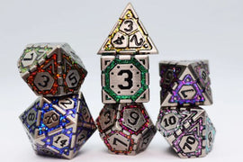 Four intricately designed metal RPG dice with colorful accents arranged in a playful stack. The dice feature varying geometric shapes and numbers, showcasing vivid hues of purple, green, red, and blue, perfect for tabletop gaming enthusiasts.