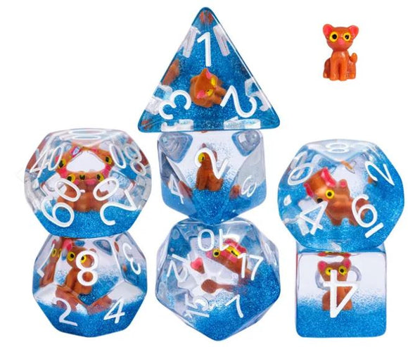 Honey the Cat RPG Dice Set featuring six colorful dice with embedded playful cat figures and sparkling blue glitter. The set includes various die shapes such as a tetrahedron, dodecahedron, and cube, perfect for tabletop role-playing games.