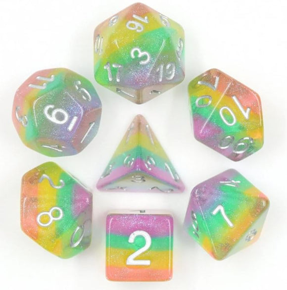 Colorful Fairy Dust RPG dice set featuring various polyhedral dice in a sparkling, gradient pattern of pink, green, and blue hues. Each die has clear numerical markings for easy reading, perfect for tabletop gaming enthusiasts.