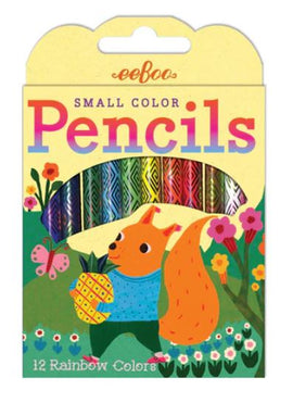 The Eeboo Small Color Pencils pack features a vibrant illustration of a playful squirrel holding a pineapple amidst colorful flowers and butterflies. The pack contains 12 rainbow-colored pencils arranged at the top, showcasing a variety of hues perfect for creative projects.
