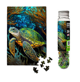 A vibrant jigsaw puzzle featuring a beautifully illustrated sea turtle swimming among colorful coral. The puzzle comes housed in a clear tube packaging, showcasing the intricate design with pieces laid out. Ideal for marine life enthusiasts and puzzle lovers alike.