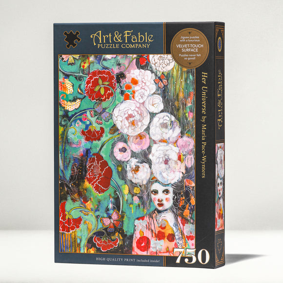 Her Universe Jigsaw Puzzle by Art & Fable Puzzle Co featuring a colorful artistic design with flowers and a whimsical portrait. This 750-piece puzzle showcases a luxurious velvet-touch surface and includes a high-quality print. Perfect for art lovers and puzzle enthusiasts.