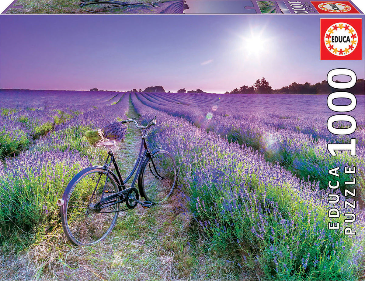 A serene jigsaw puzzle image depicting a vintage bicycle parked amidst a vast lavender field under a bright sunny sky. The lush purple flowers stretch out into the distance, creating a calming and picturesque landscape.