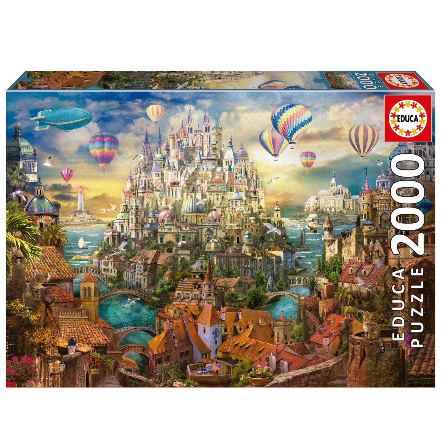 Dream Town jigsaw puzzle by Educa featuring a vibrant and intricate illustration of a fantastical cityscape with hot air balloons, ornate buildings, and serene waterways. This 2000-piece puzzle invites you to explore each detail as you assemble the picturesque scene.