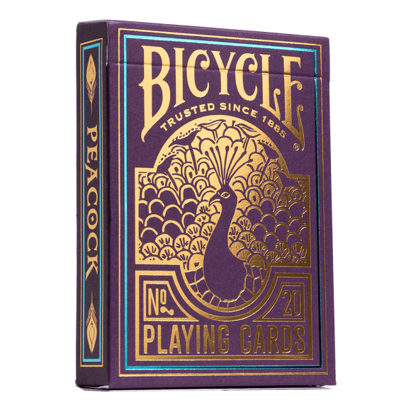 Bicycle Purple Peacock playing cards package showcasing a vibrant purple design with gold accents. The front features an elegant peacock illustration and the brand name 'Bicycle' prominently displayed, symbolizing quality and fun for card games.