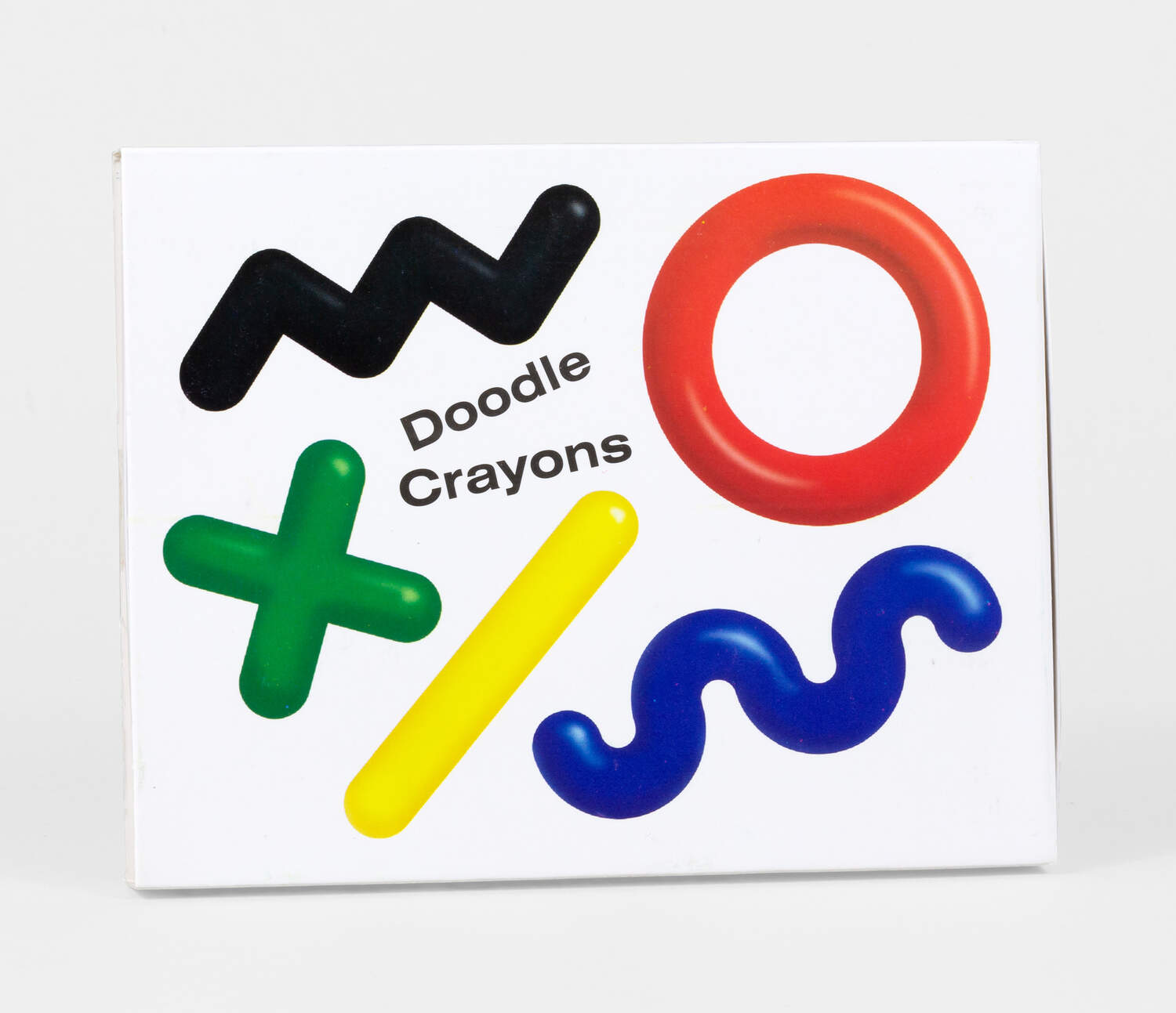 A colorful packaging for Doodle Crayons by Areaware, featuring various shaped crayons in black, green, red, yellow, and blue on a white background. The design highlights creativity and fun.