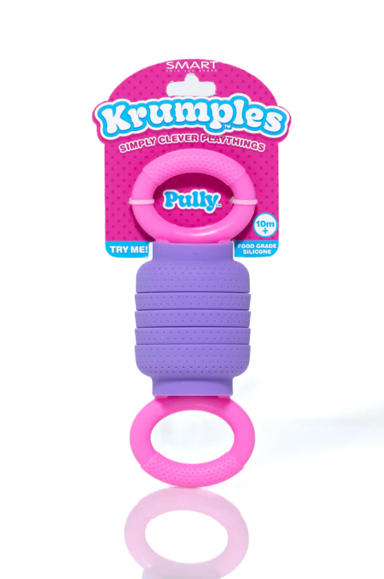 Krumples Pully by Smart Toys & Games displayed on a white background. The product features a colorful silicone design in purple and pink, designed for children aged 10 months and older. It promotes sensory play and is made from food-grade silicone, making it safe for little hands to engage with. The packaging highlights the product as part of the Krumples line, showcasing its fun and playful nature.