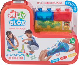 The Jelly BloX Creative Kit by Goliath features colorful, squishy building blocks ideal for open-ended play. The packaging displays children stacking the blocks and emphasizes fun attributes like being stretchy, twisty, and smooshy. The kit is suitable for ages 2 and up.
