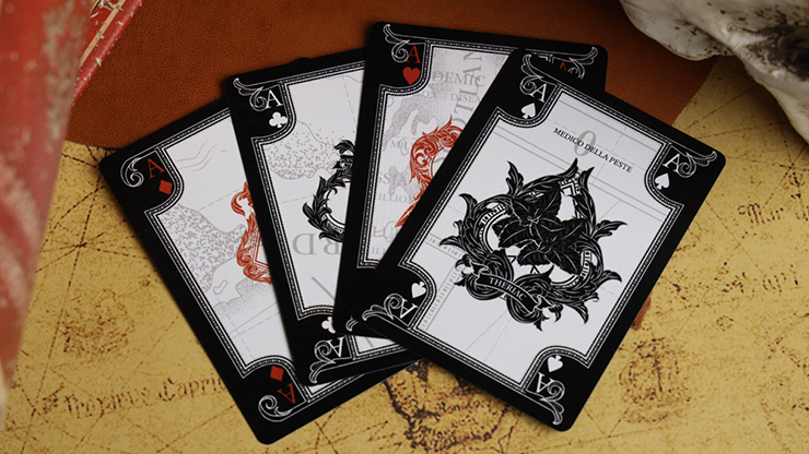 A close-up view of Plague Doctor playing cards featuring intricately designed black and white cards with gothic motifs and unique illustrations. The cards are spread out over a vintage map background, showcasing their artistic flair.