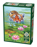 Cobble Hill 'Land of the Lotus' jigsaw puzzle featuring a vibrant illustration of a tiger peering out of a tranquil pond surrounded by pink water lilies and lush lily pads. The puzzle contains 1000 pieces and includes a poster for reference.