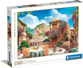 Clementoni 1500 pc jigsaw puzzle titled 'Italian Sight.' The box features a beautiful scenic view of an Italian village with vibrant flowers, terrace tables, and mountains in the background. Perfect for puzzle enthusiasts seeking high-quality imagery.