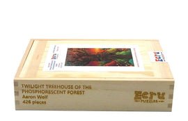 A wooden jigsaw puzzle box featuring the title 'Twilight Treehouse of the Phosphorescent Forest' by Aaron Wolf, displaying vibrant artwork of a mystical forest scene on the front. The box is made of natural wood, showcasing an engraved design, and has a label indicating it contains 426 pieces.