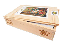 A wooden jigsaw puzzle box titled 'Flowers by J.C. Roedig' featuring a floral artwork on the lid. The box is made of light-colored wood with the words 'ARTIFACT PUZZLES' engraved on the side. It contains 293 pieces.
