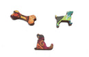 Morning Rays jigsaw puzzle by Lisa Graa Jens, featuring intricately cut wooden pieces shaped like a dog, a dog bone, and a whimsical dog figure, showcasing vibrant colors and unique designs.
