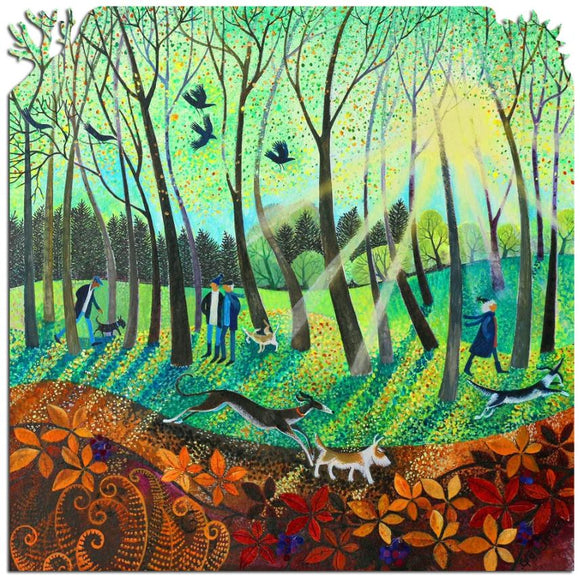 A vibrant jigsaw puzzle titled 'Morning Rays' by Lisa Graa Jens, designed by Artifact Wooden Puzzles. The illustration features a serene forest scene with two people walking dogs under sunlight filtering through trees, surrounded by colorful autumn leaves and birds in a bright blue sky.