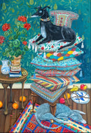 A colorful jigsaw puzzle featuring a whimsical scene of a black dog comfortably resting on a stack of vibrant, patterned cushions. The background is adorned with textured green hues, and a plant with red flowers is placed beside a small table holding books and a decorative vase. The floor is covered with a richly designed rug, with pieces of fruit scattered nearby, creating a warm and inviting atmosphere.