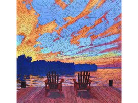 A colorful jigsaw puzzle featuring two red chairs on a wooden dock overlooking a tranquil lake at sunset. The sky is filled with vibrant clouds in shades of orange, pink, and blue, reflecting the peaceful ambiance of the scene. Perfect for puzzle enthusiasts and nature lovers.