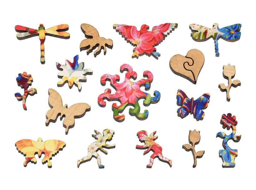 A colorful collection of unique jigsaw puzzle pieces featuring designs of butterflies, flowers, and whimsical shapes, crafted from high-quality wood. Each piece showcases vibrant colors and artistic patterns, highlighting the craftsmanship of Liberty Puzzles' Mayflower Premium Bulbs.