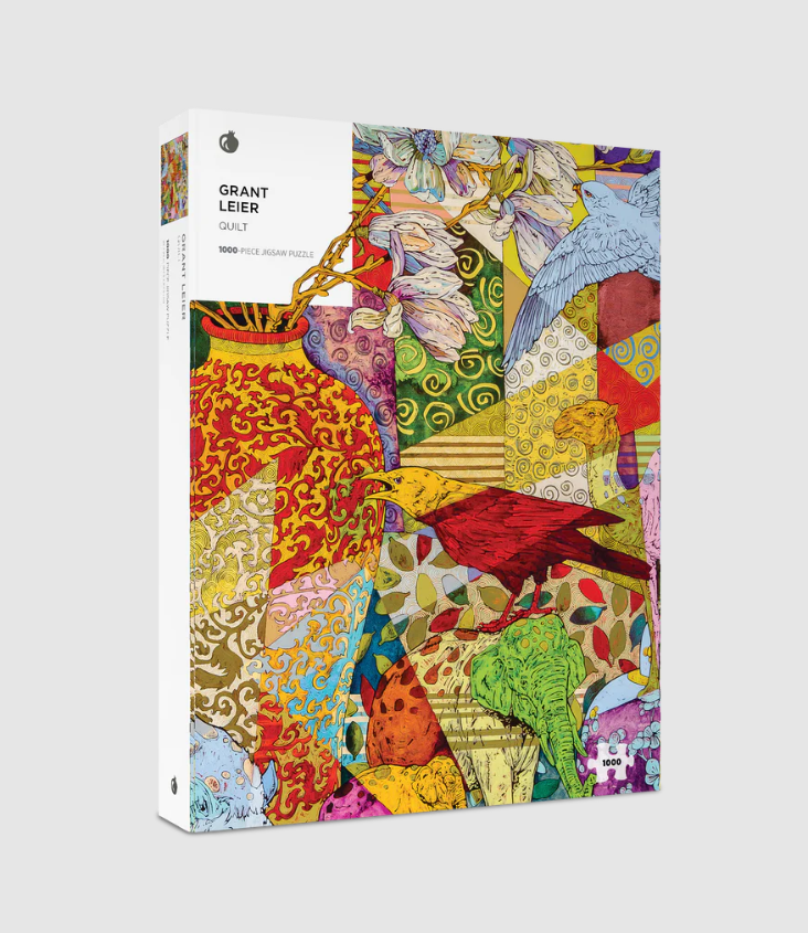 Pomegranate Jigsaw Puzzle featuring vibrant artwork by Grant Leier, comprising 1000 pieces. The design showcases an intricate pattern with colorful birds, floral elements, and abstract shapes, perfect for puzzle enthusiasts seeking a challenging yet visually stunning experience.