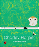 A vibrant green deck of Charley Harper playing cards featuring whimsical illustrations of various animals and nature elements. The design showcases a blend of artistic graphics, including a recognizable owl icon. The cards are packaged in a colorful box with the name 'Charley Harper' prominently displayed.