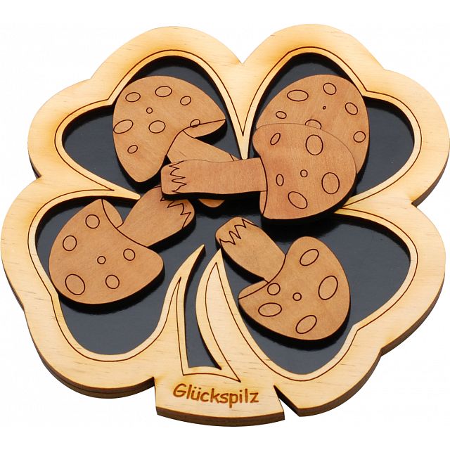 Glückspilz Micro by Jean Claude is a mechanical puzzle featuring a wooden design that showcases a four-leaf clover with playful mushroom pieces interlocked within. The natural wood finish adds a charming aesthetic, making it an engaging challenge for puzzle enthusiasts of all ages.