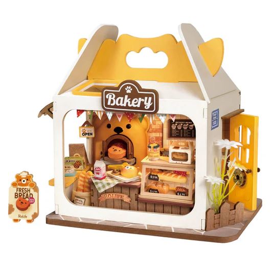 Teddy's Breadbox Model by Robotime is a charming DIY kit featuring an intricate miniature bakery scene, complete with baked goods, a baker figure, and detailed decor. The design showcases a warm color palette with a sign that reads 'Bakery' and a 'Fresh Bread' sign outside, creating a delightful atmosphere for creative minds.