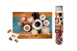 Coffee Micropuzzle by Micro Puzzle featuring a vibrant jigsaw design with various coffee cups and a turquoise background. The packaging displays a clear bottle filled with puzzle pieces, showcasing a cozy 'coffee time' theme, perfect for puzzle enthusiasts and coffee lovers.