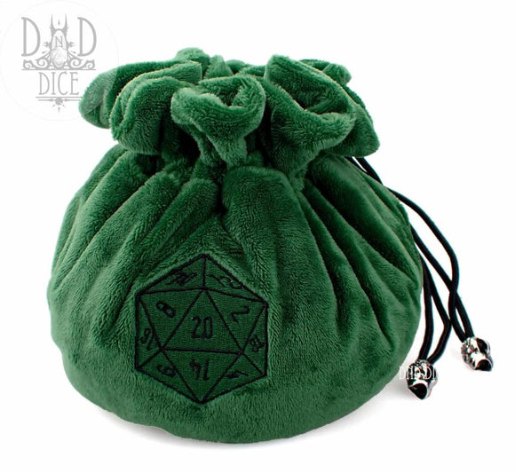 A plush green dice bag from DND Dice, featuring a drawstring closure and a printed 20-sided die design on the front. It's made of soft fabric, perfect for storing gaming dice.