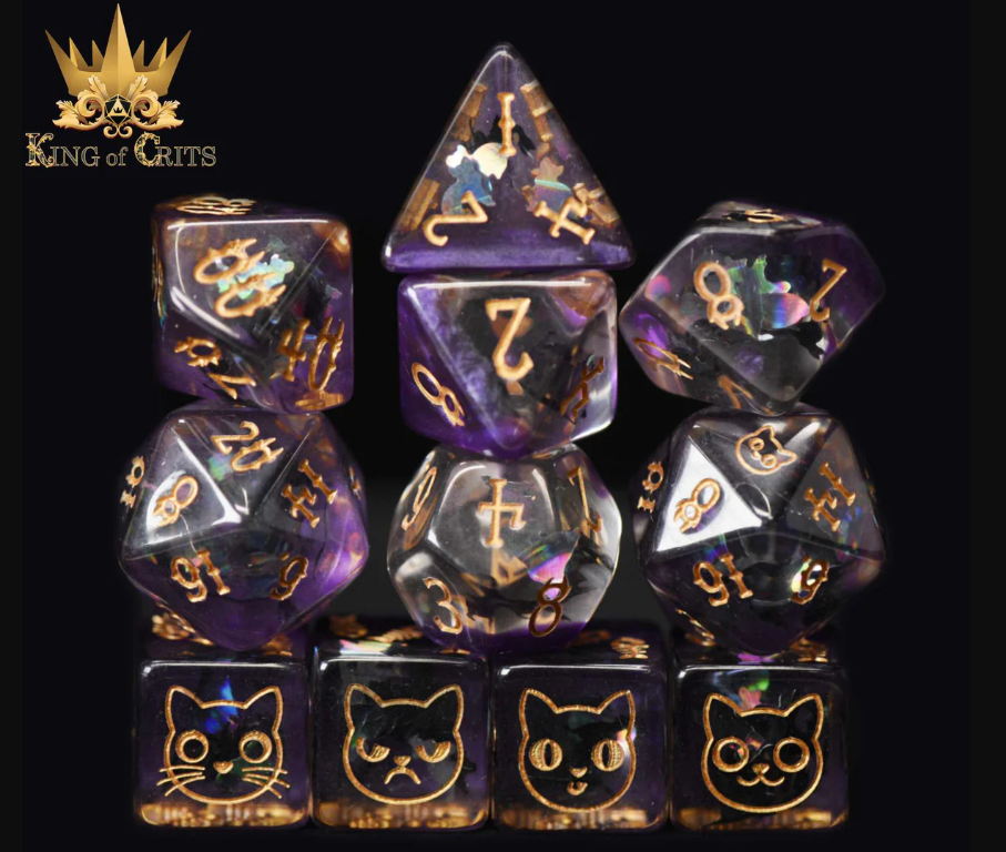 The Cat's Meow 11-piece RPG dice set from King of Crits, featuring a variety of intricately designed dice in purple hues with gold numbers and cat illustrations. Perfect for tabletop gaming.