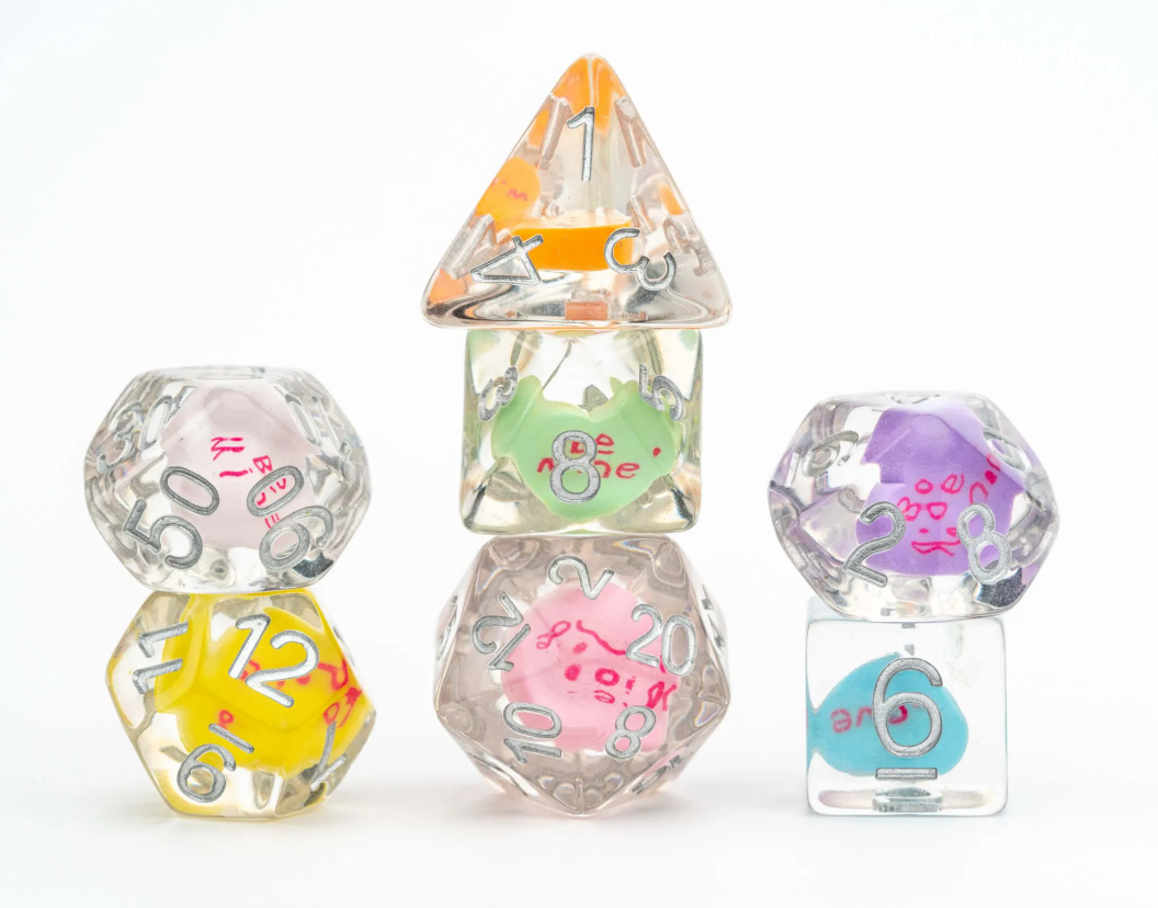 A colorful Valentine's Love RPG Dice Set featuring a variety of polyhedral dice, including a pink d20, green d6, purple d8, yellow d12, and an orange pyramid d4, all encased in transparent resin with whimsical designs inside. Perfect for tabletop gaming and role-playing enthusiasts.