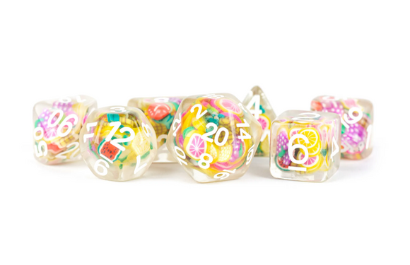 A colorful set of Fruit RPG Dice by FanRoll, featuring translucent resin with vibrant fruit designs embedded inside. The numbers are clearly printed in white on each die, creating a playful and eye-catching look perfect for tabletop gaming enthusiasts.