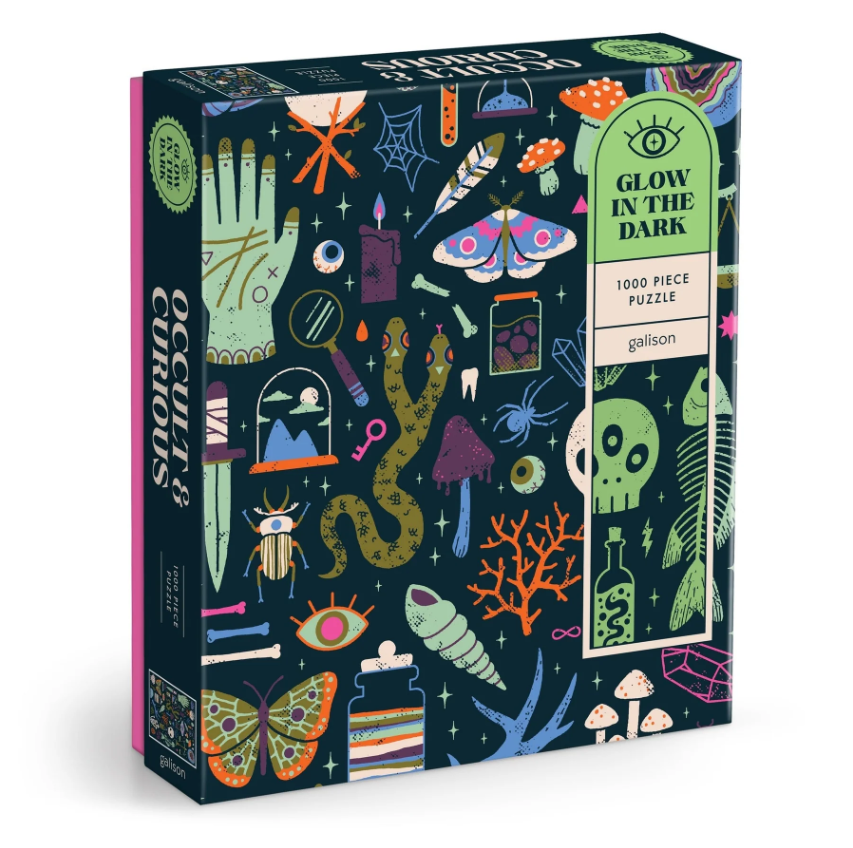 Occult and Curious Glow in the Dark jigsaw puzzle by Galison featuring vibrant illustrations of mystical themes such as skeletons, mushrooms, spiders, and more in glowing colors on a dark background. The puzzle contains 1000 pieces and is packaged in an eye-catching box with intricate designs.