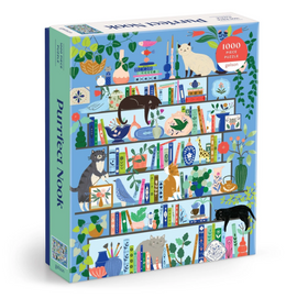 The Purrfect Nook jigsaw puzzle features a colorful illustration of a bookshelf adorned with various plants, books, and playful cats. This 1000-piece puzzle invites cozy moments of assembly, bringing joy to puzzle enthusiasts and cat lovers alike.