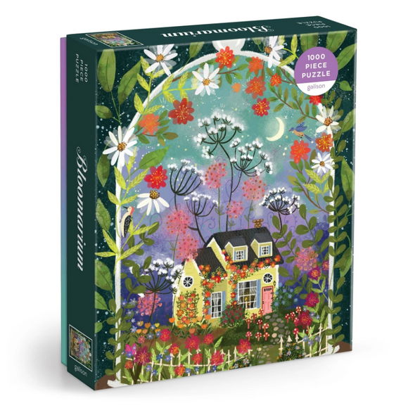 The Bloomarium Jigsaw Puzzle by Galison features a vibrant illustration with a charming yellow house surrounded by colorful flowers, plants, and a starry sky. It has 1000 pieces and promises an engaging puzzle experience for all ages.