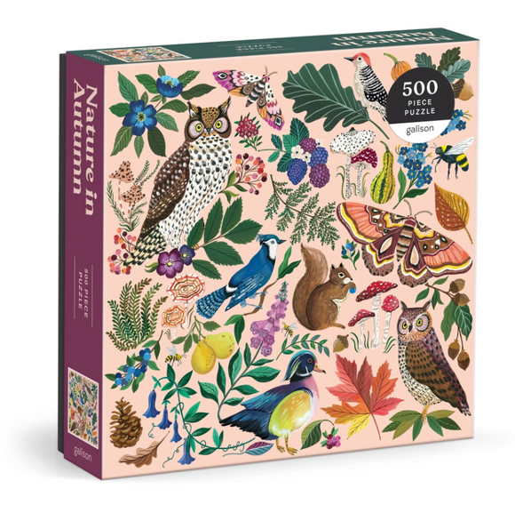 The 'Nature in Autumn' jigsaw puzzle by Galison features a vibrant collection of autumn flora and fauna, including colorful birds, an owl, a squirrel, butterflies, and various leaves and flowers. Packaged in a beautifully illustrated box showcasing the intricate design of the 500 puzzle pieces.