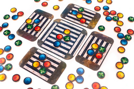 An engaging board game titled 'Umbrella' by PANDASAURUS GAMES featuring colorful tokens and striped game cards arranged on a white background. The image showcases the vibrant game components, perfect for family fun and strategic gameplay.