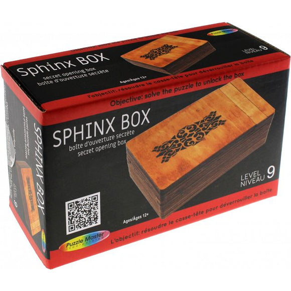 Sphinx Box by Puzzle Master, a mechanical puzzle designed as a secret opening box. The packaging features a wooden design with an intricate pattern on top, emphasizing the challenge of unlocking the box. Suitable for ages 12 and up, it offers a level 9 difficulty.