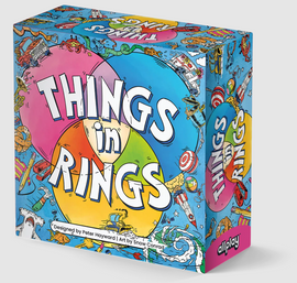 The colorful box of the game 'Things in Rings' by Allplay, featuring vibrant illustrations of various whimsical objects and playful designs. The title is prominently displayed in bold letters against a lively background.