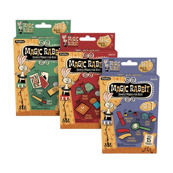 Three colorful packaging sets of MAGIC TRICKS by Schylling, titled 'Simple Magic for Kids'. Each set features vibrant illustrations and includes various magic tricks with a magic instruction booklet. Set 1 in blue includes items like a color vision puzzle, Set 2 in red showcases a money factory, and Set 3 in green features a changing card. Ages 6+.