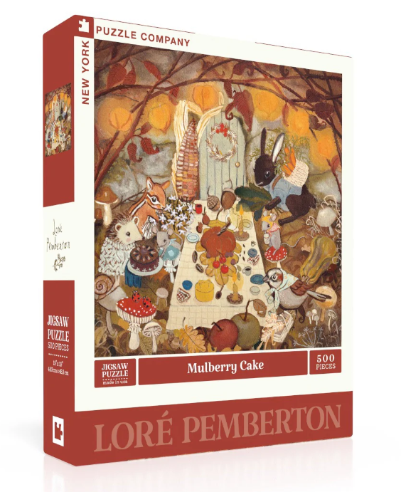 A vibrant jigsaw puzzle box titled 'Mulberry Cake' by New York Puzzle Company. The illustration features a whimsical woodland scene with various animals gathered around a table filled with colorful desserts, including a mulberry cake. The box showcases the artwork by Loré Pemberton and indicates it contains 500 pieces.