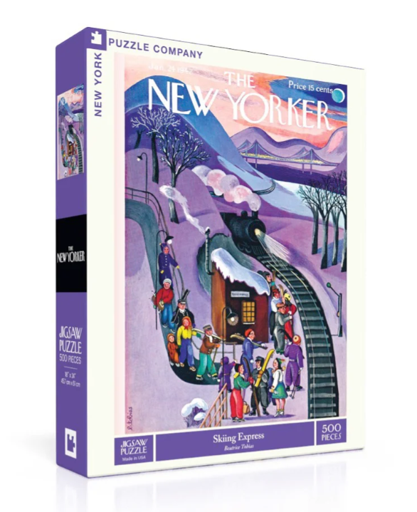 A colorful jigsaw puzzle box titled 'Skiing Express' by New York Puzzle Company. The box features an illustrated scene from a New Yorker cover depicting people skiing and enjoying winter activities, surrounded by snow-covered trees and a mountain backdrop. The puzzle consists of 500 pieces and measures 18 x 24 inches when completed.