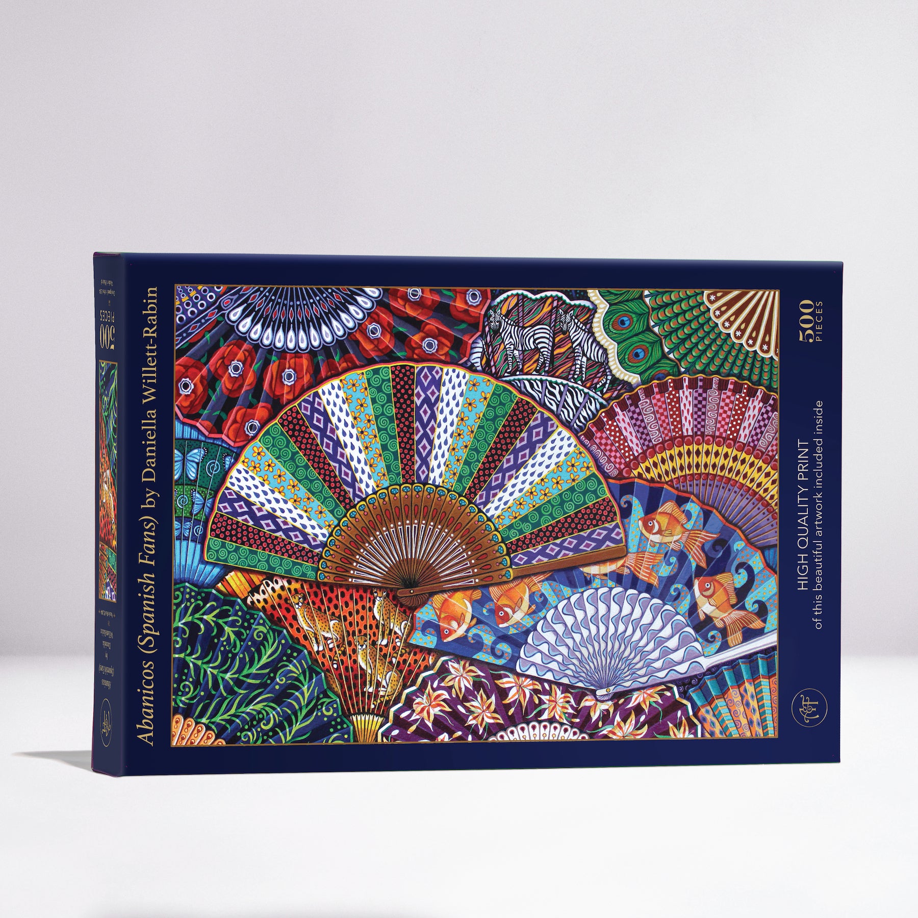 Jigsaw puzzle box featuring the vibrant artwork of Abanicos (Spanish Fans) by Daniella Willet-Rabin. The box contains 500 pieces, showcasing colorful fans decorated with intricate patterns and designs.