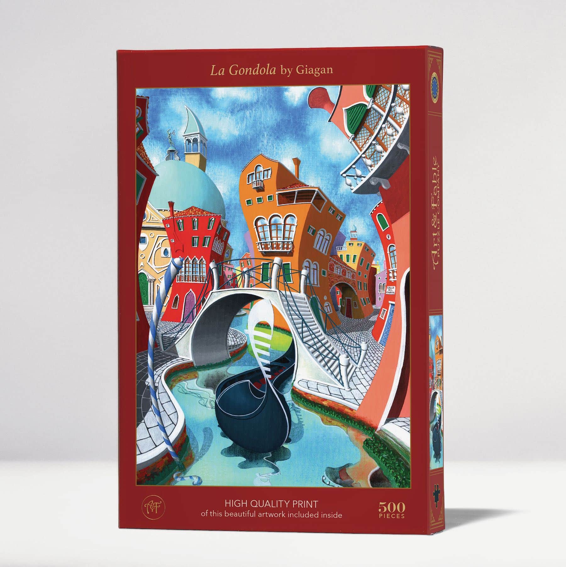 The La Gondola jigsaw puzzle by Art & Fable Puzzle Co features a vibrant scene depicting colorful buildings and a gondola navigating a serene canal. The puzzle includes 500 pieces and is beautifully designed, showcasing an artistic interpretation by Giagan. The box displays details about the included high-quality print of the artwork.