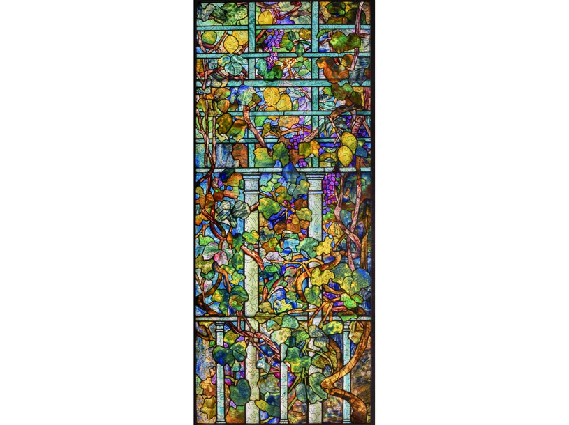 Beautiful jigsaw puzzle featuring a vivid design of lemon trees and grapevines, showcasing colorful leaves and detailing reminiscent of stained glass art by Liberty Puzzles.